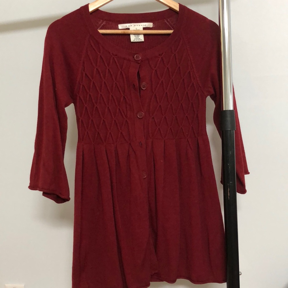 Sweater with buttons.